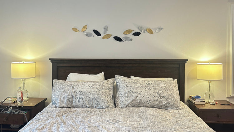 Modern ceramic wall sculpture installation  Textured handmade ceramic wall art  Ceramic sculpture above taupe sofa in living room