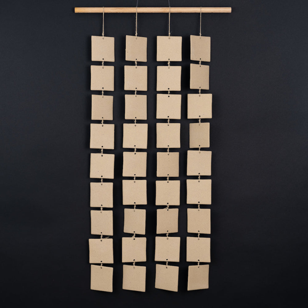 ceramic curtain panels in modern living room, adding sculptural wall texture