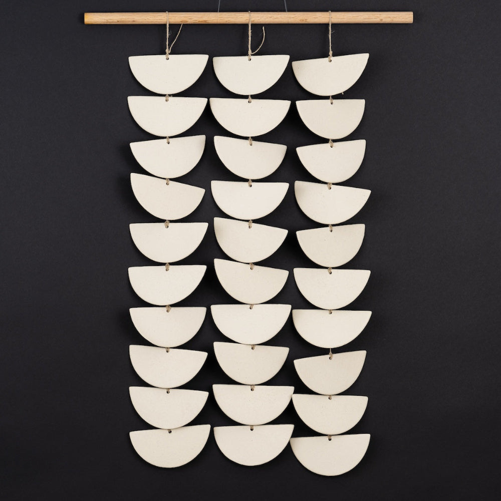 ceramic curtain showing layered clay textures and natural light reflection