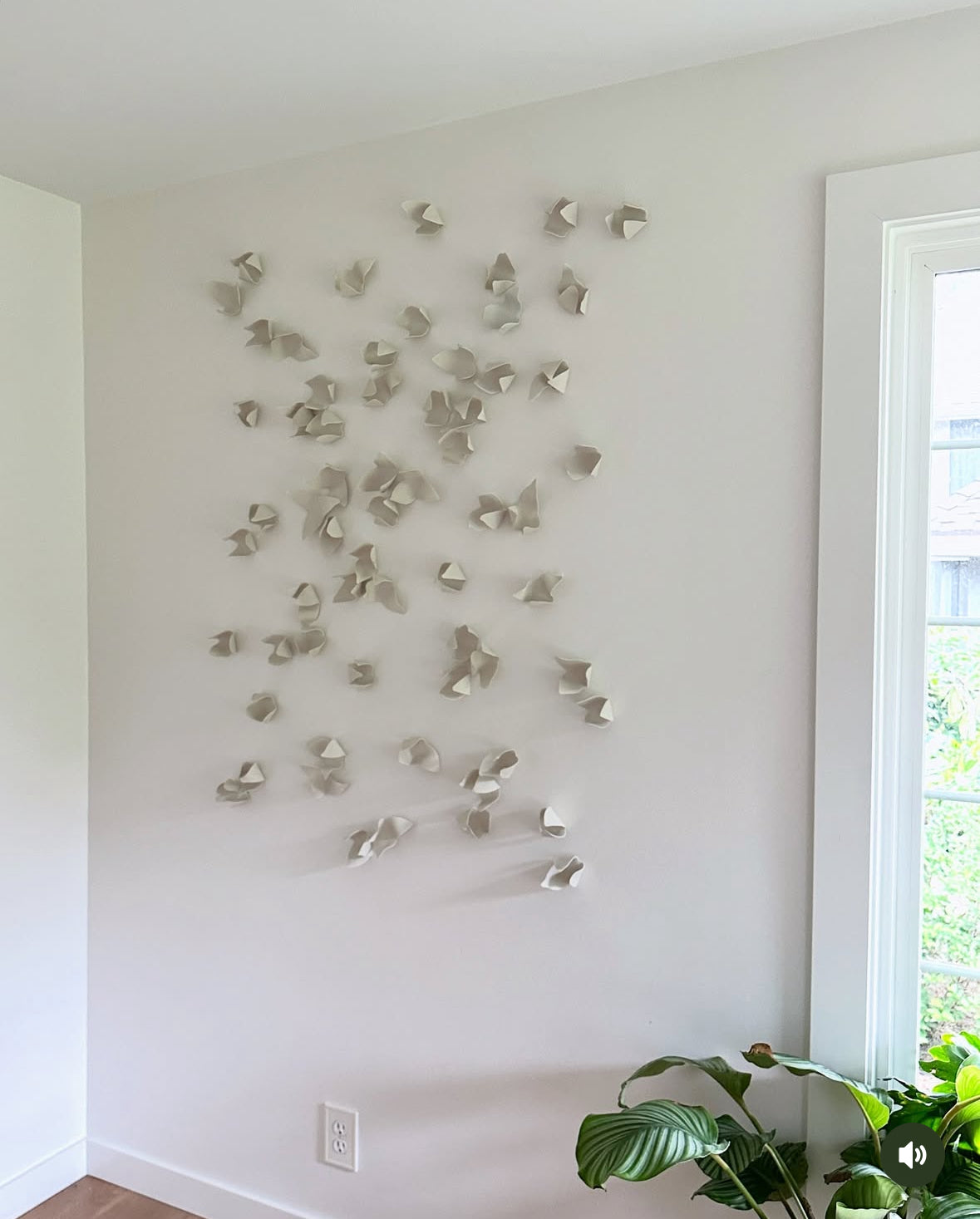 Neutral-toned ceramic wall art blends with a soft interior palette in Sammamish