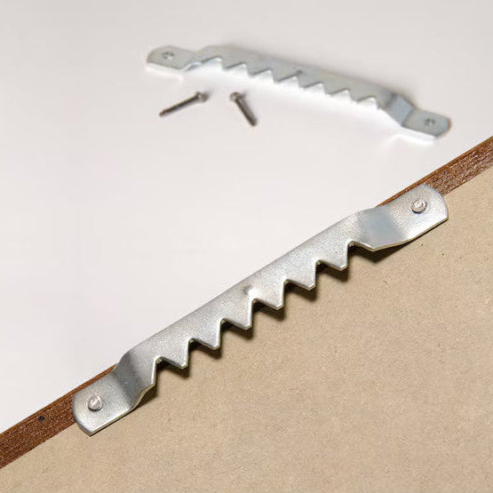 Completed child’s artwork collage displayed on living room wall 