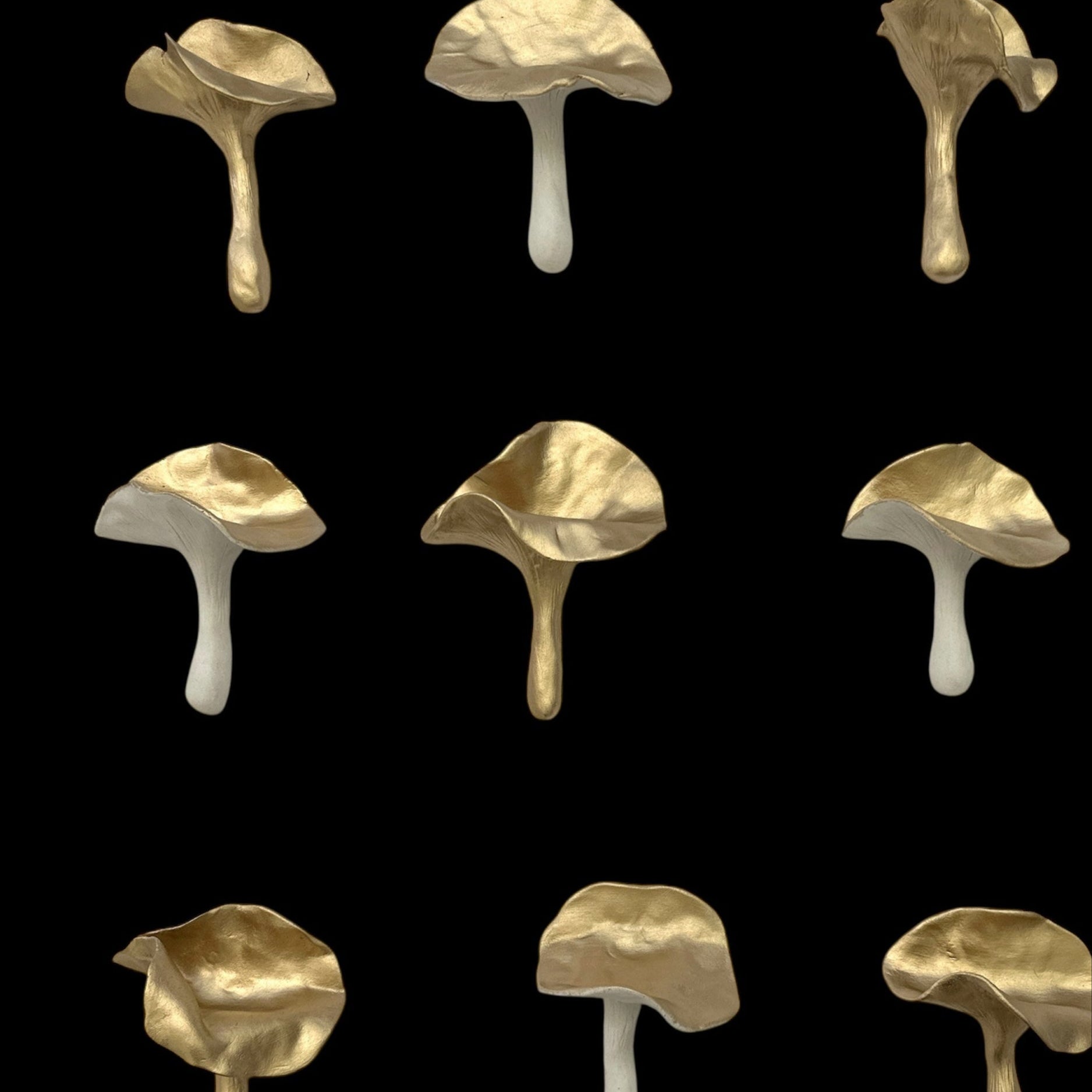 Pattern of ceramic gold mushrooms on a black background