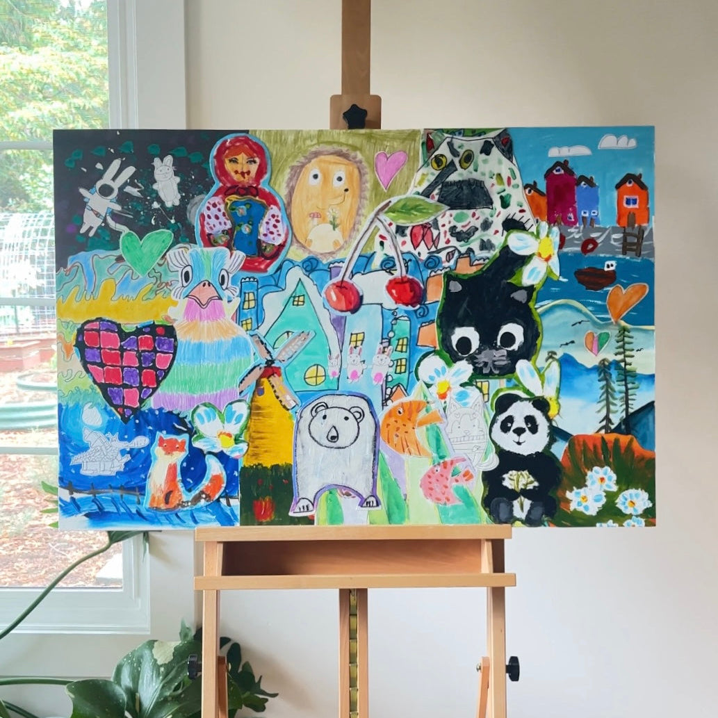 Colorful children's artwork on a canvas displayed on an easel indoors.