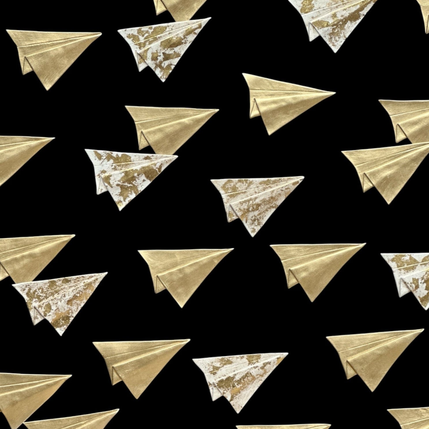 Pattern of gold paper airplanes on a black background