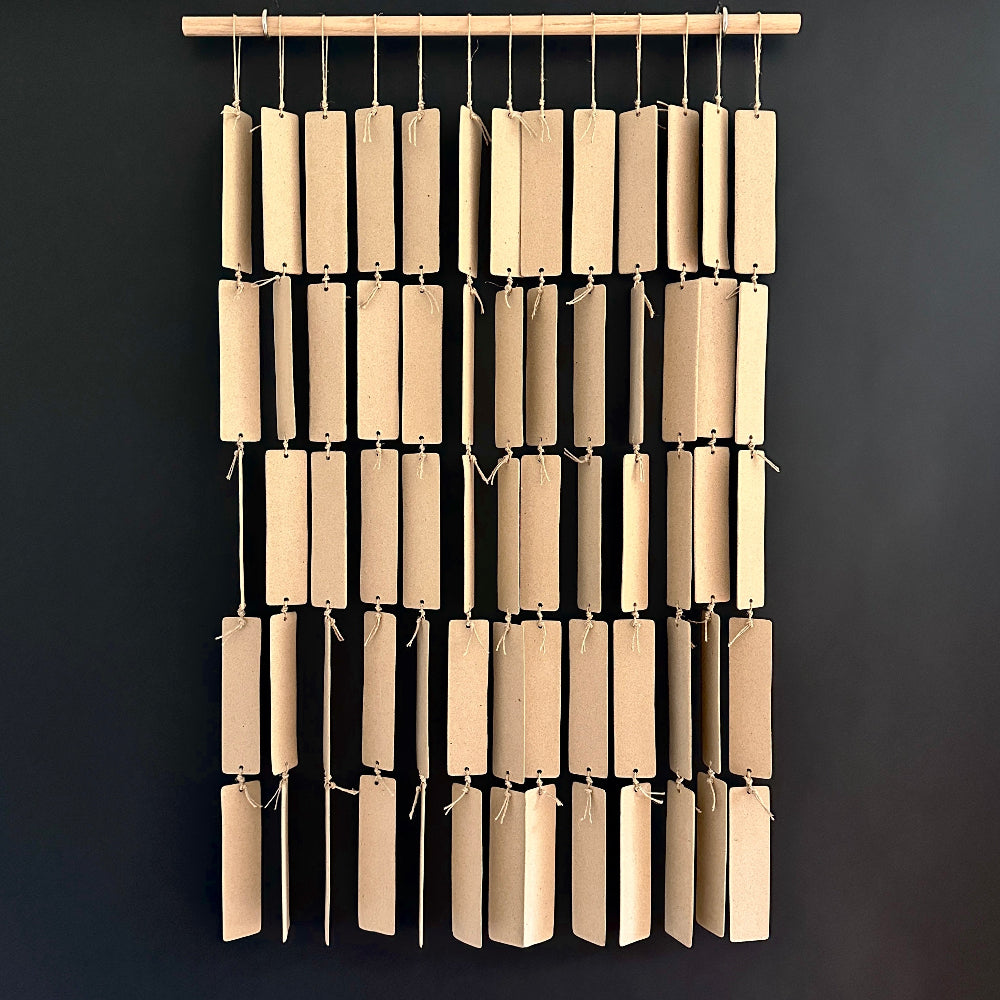 Handcrafted ceramic curtain panel with organic textures, designed for modern interiors.