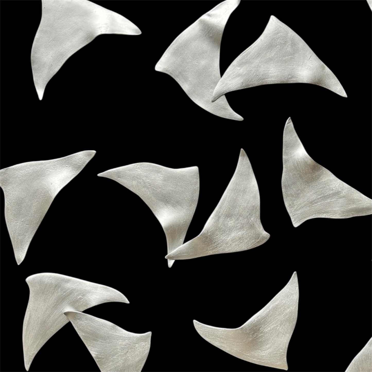 Silver abstract shapes on a black background