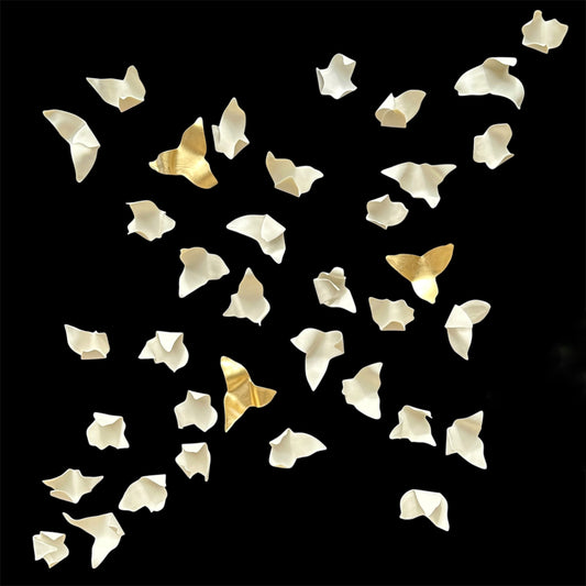 Gold and white petals decorations on a black background